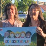 2 women holding kids deserve play poster