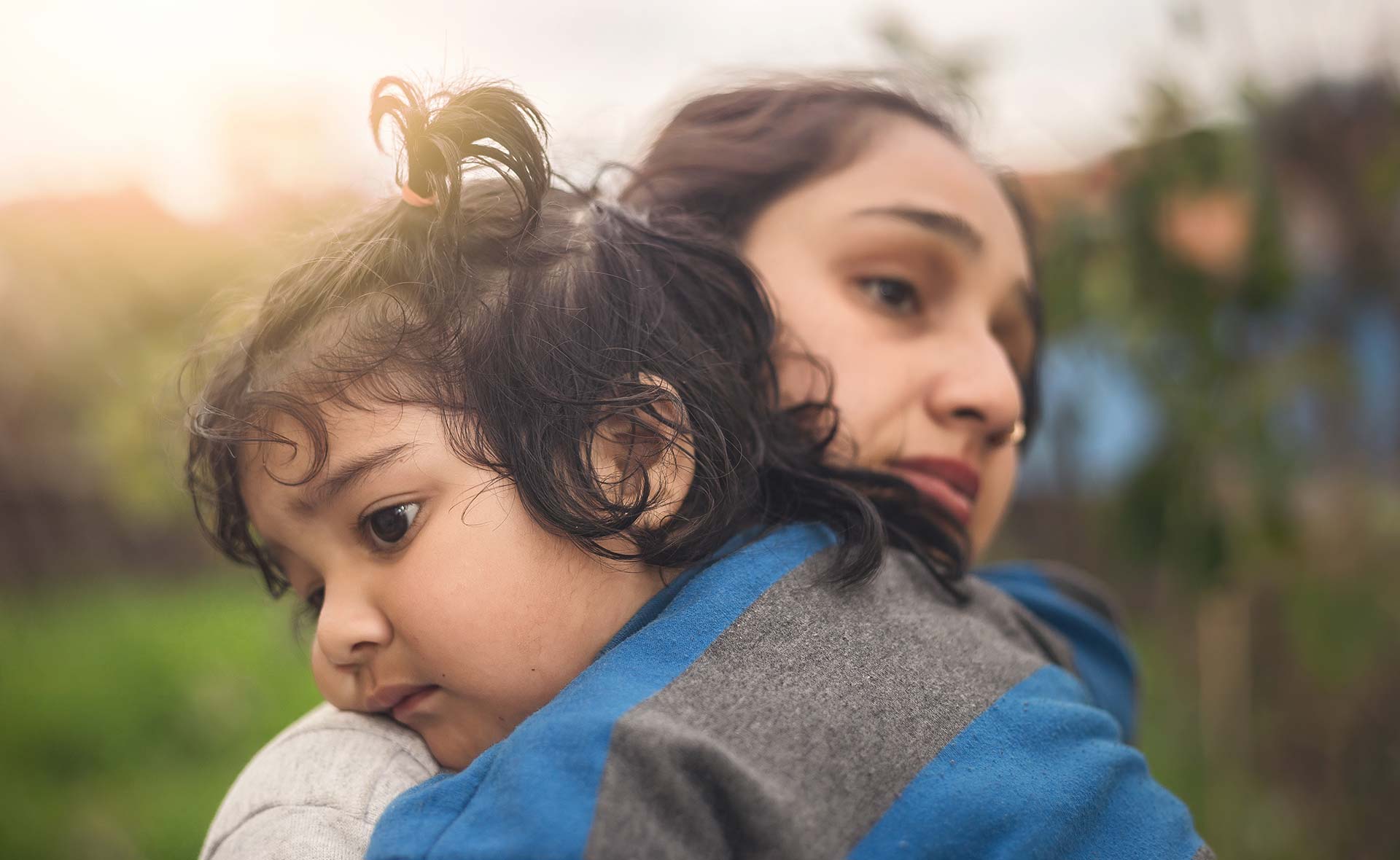 Woman hugging child