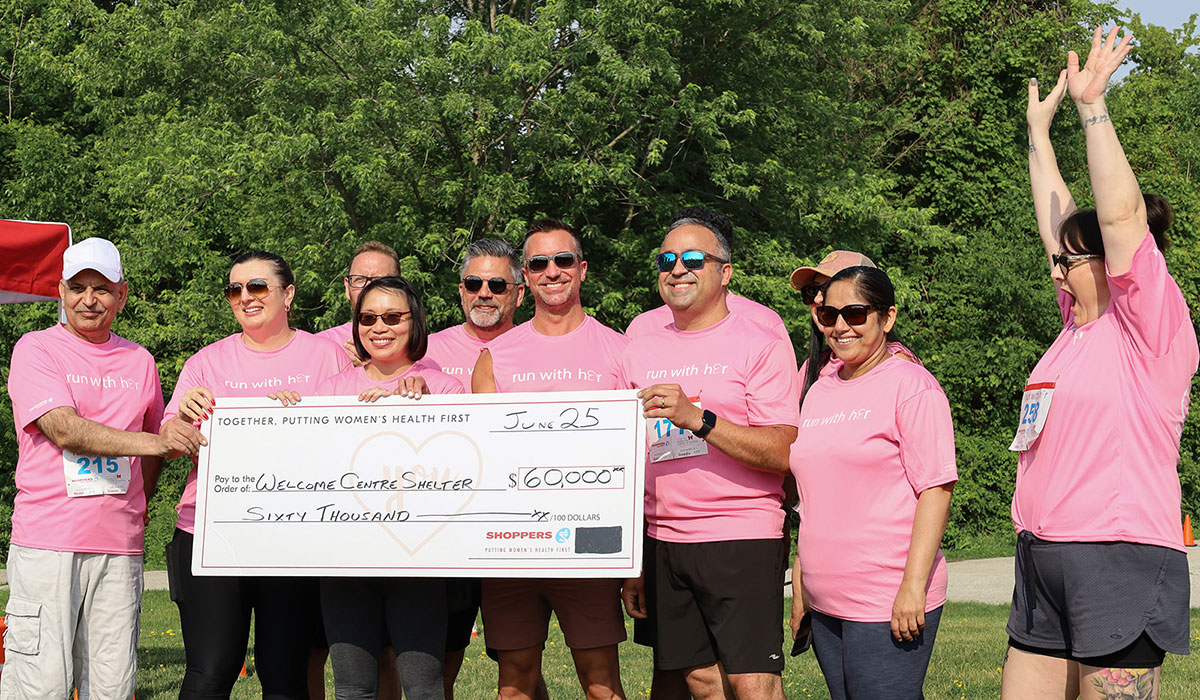 Cheering large donation check