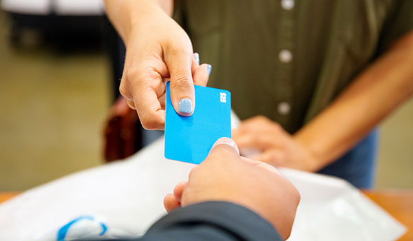 Handing over gift card of $25