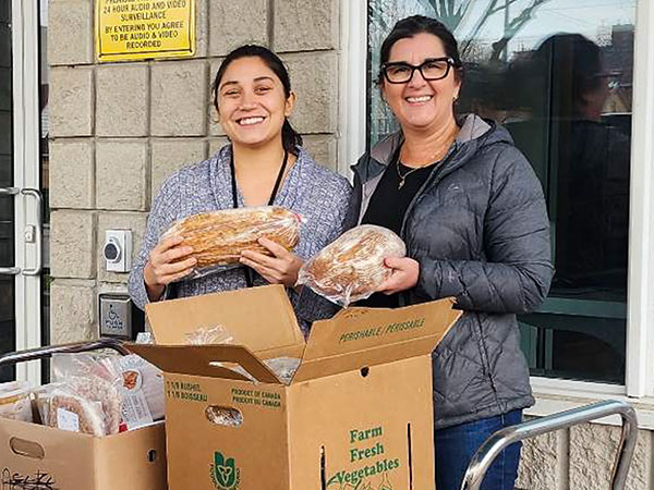 2 women donating bread