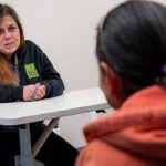 women's peer support woman assisting other woman